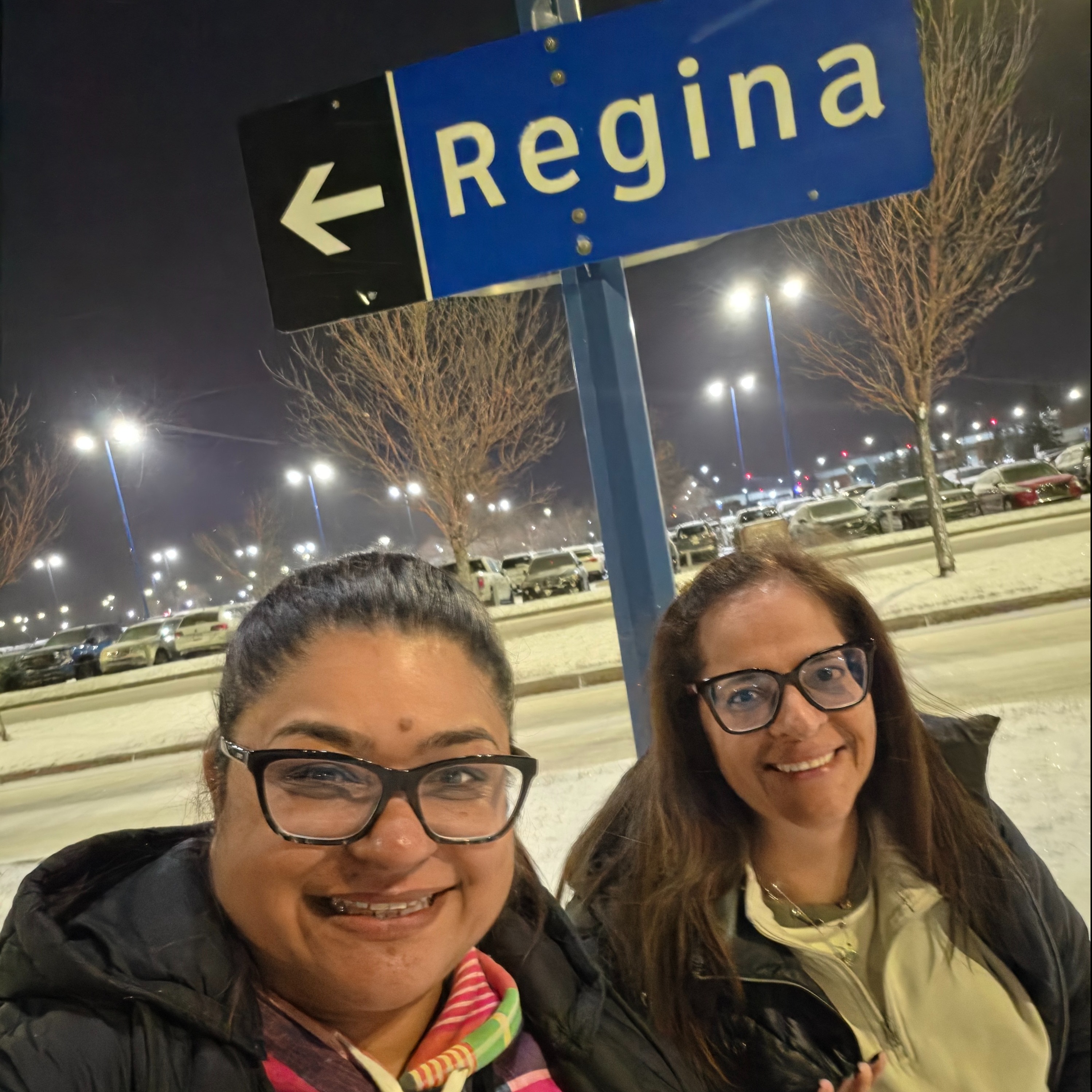 Nadia and Rosario under Regina sign